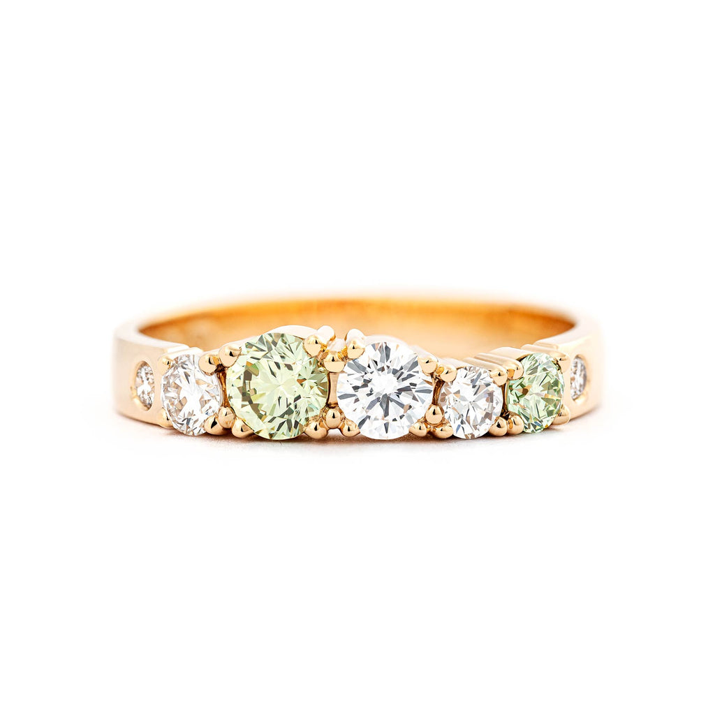 Keto Meadow Spring collection's 3mm wide ring with different size Pine Green diamonds and white diamonds. Design by Jussi Louesalmi, Au3 Goldsmiths