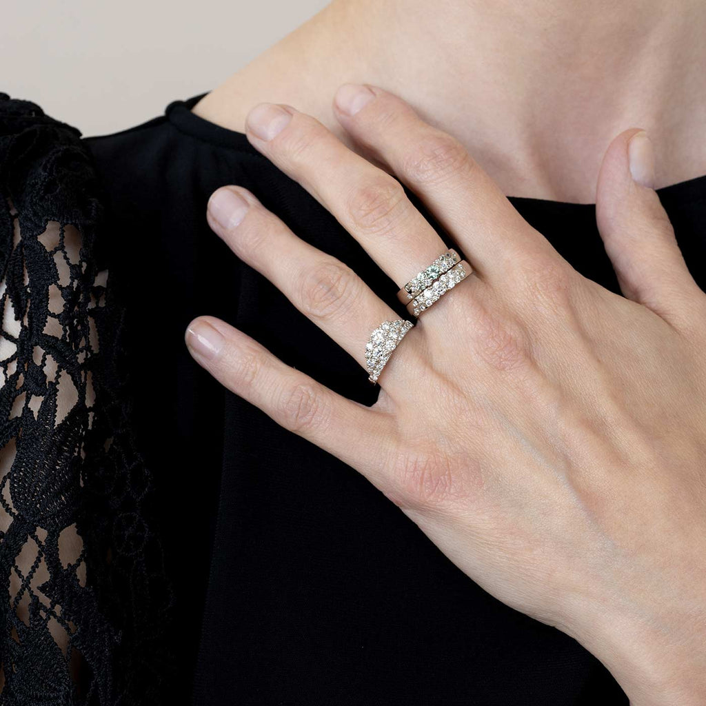 Model wearing a Kaje and Keto Meadow diamond rings. Design by Jussi Louesalmi, Au3 Goldsmiths.
