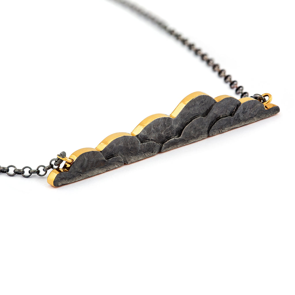 Dark patinated gold plated silver necklace with a gold lining. Design by Anu Kaartinen, Au3 Goldsmiths.