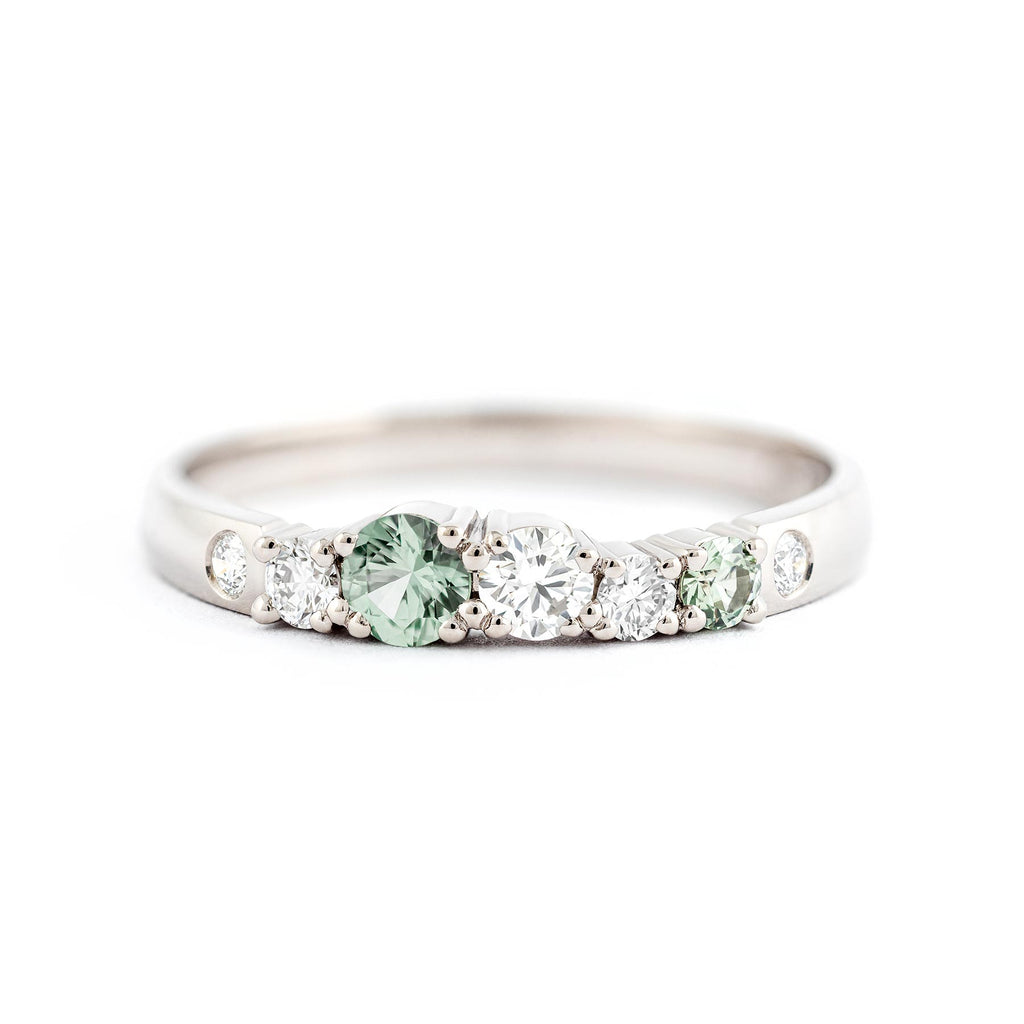 Pastel green sapphires in the 2,5mm wide diamond ring, design by Jussi Louesalmi, Au3 Goldsmiths