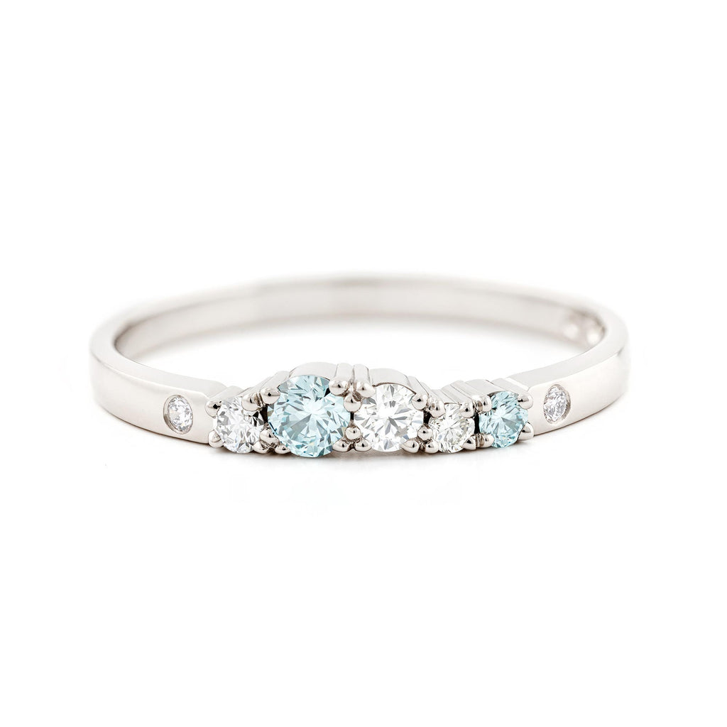 Keto Meadow 2mm wide ring in 750 white gold / 950 platinum, with Ice blue diamonds and white tw/vs diamonds. design by Jussi Louesalmi, Au3 Goldsmiths.