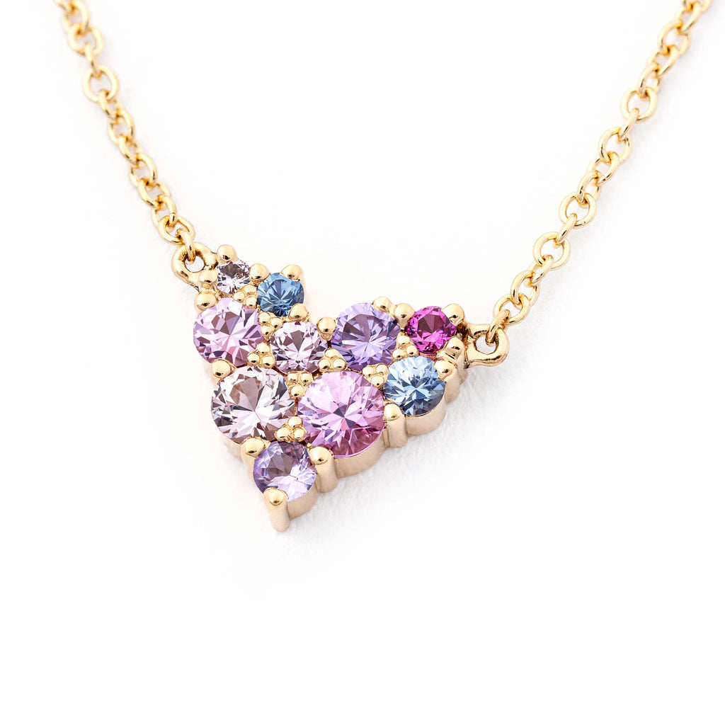 Golden heart shaped Keto Meadow necklace filled with different size colorful sapphires. Design by Jussi Louesalmi, Au3 Goldsmiths