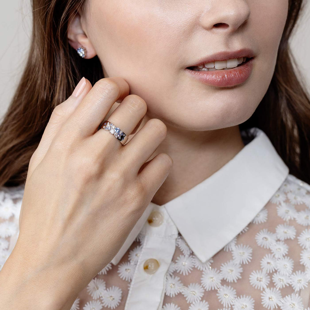 Model wearing a Keto Meadow Spring collections ring, which has blue sapphires and white diamonds. Design by Jussi Louesalmi, Au3 Goldsmiths.