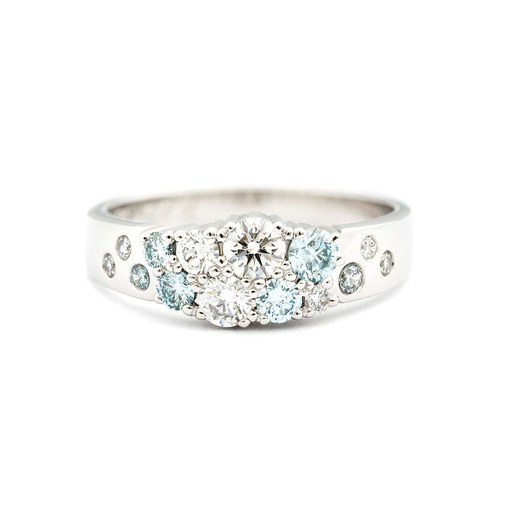 Turquoise Ice Blue diamonds with white tw/vs diamonds in the Keto Meadow narrowing ring by goldsmith Jussi Louesalmi, Au3 Goldsmiths