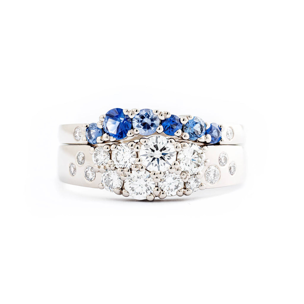 Beautiful combination of Keto Meadow narrowing ring with white diamonds and Keto Meadow Arc ring with blue sapphires and white diamonds. Design by Jussi Louesalmi, Au3 Goldsmiths.