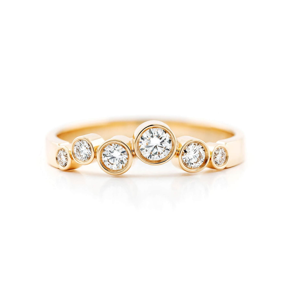 Golden ring with asymmetrically placed different size diamonds, design by Jussi Louesalmi, Au3 Goldsmiths
