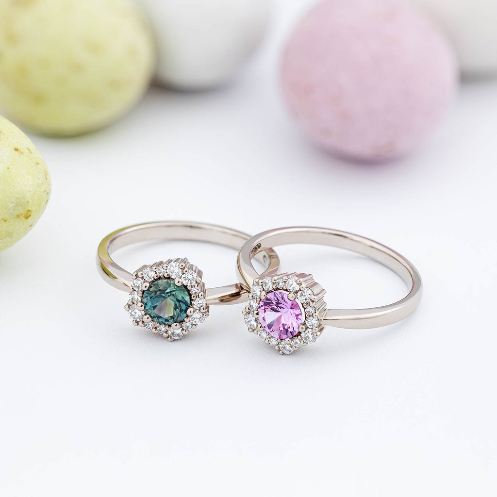 Large Montana green sapphire and pink sapphire surrounded with smaller white diamonds in the Lilibet halo rings. Design by Jussi Louesalmi, Au3 Goldsmiths.