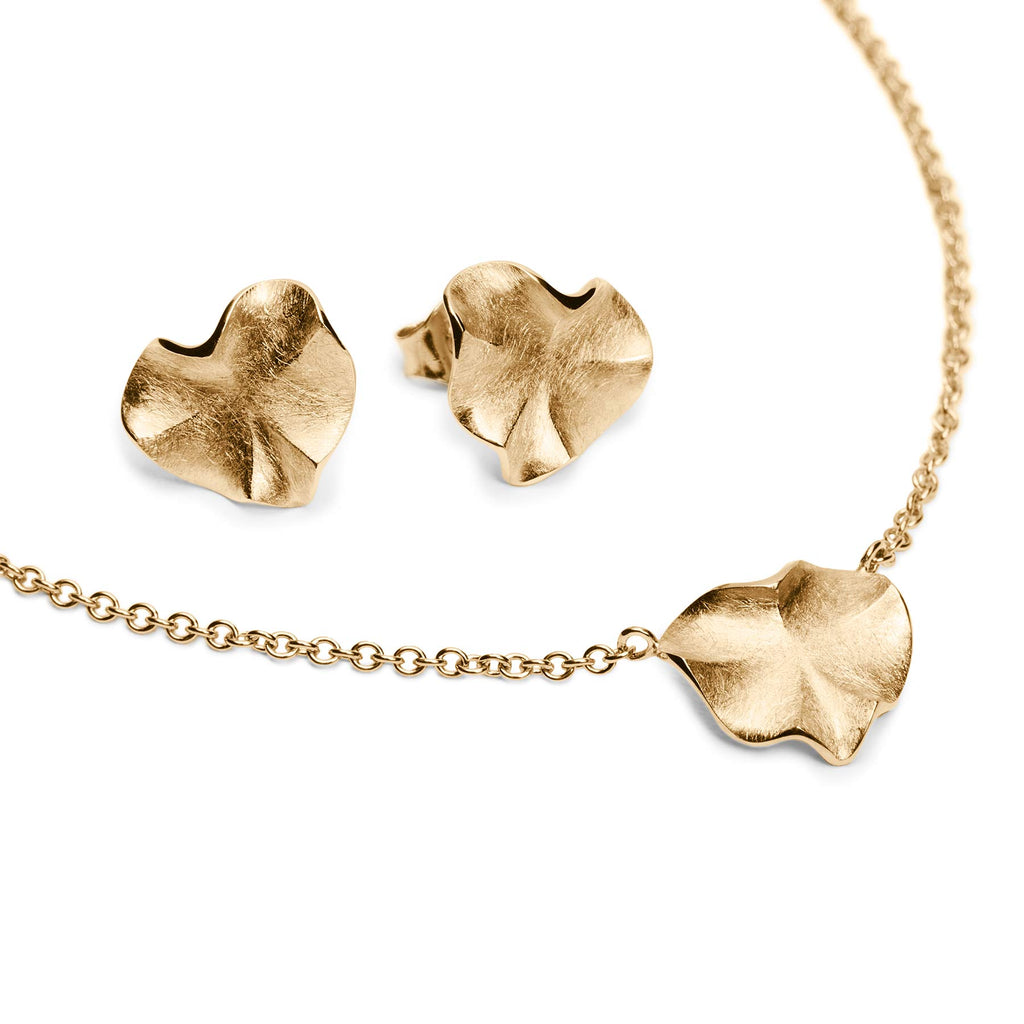 Organic shaped heart necklace and stud earrings made in 18K yellow gold, design by Anu Kaartinen.