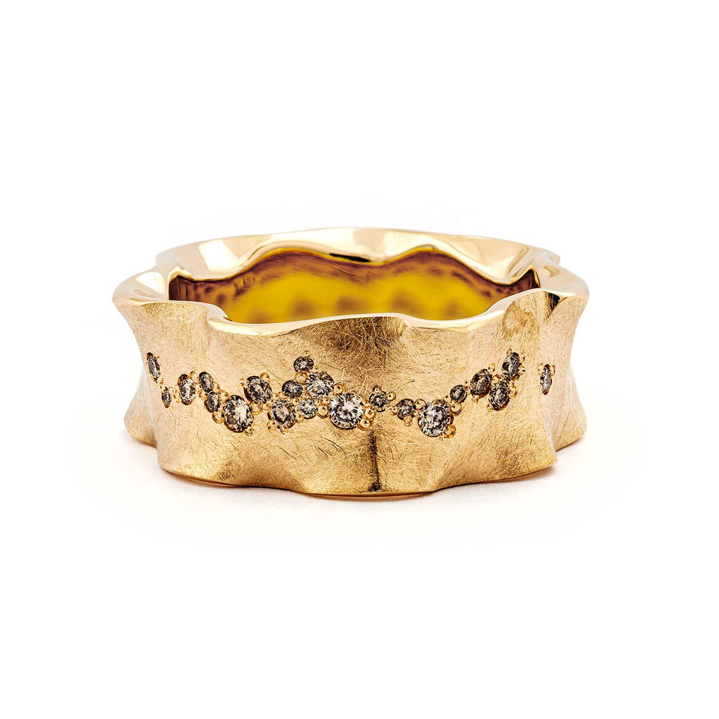 Organic shapes in the golden Hauru diamond ring by goldsmith Anu Kaartinen