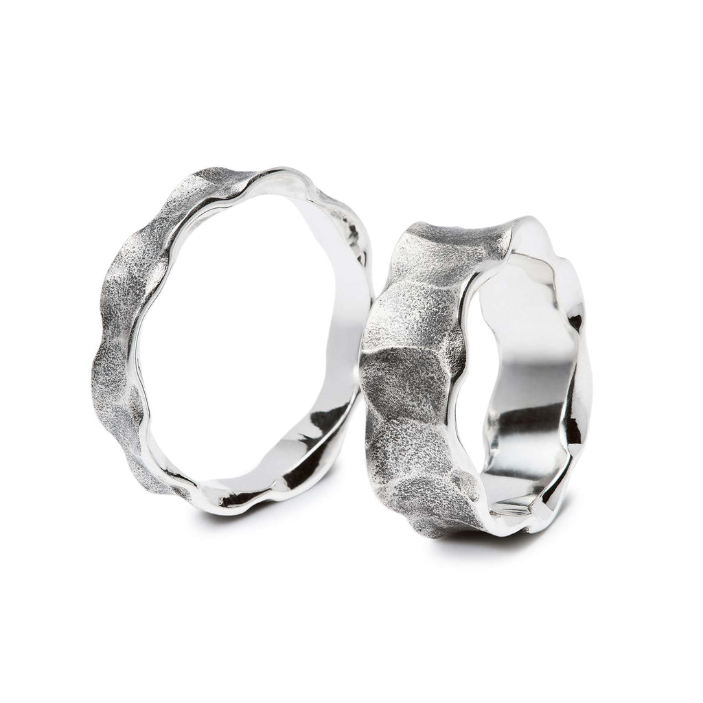 Organic shapes in the two different width Hauru rings made in 925 silver. Design by Anu Kaartinen.