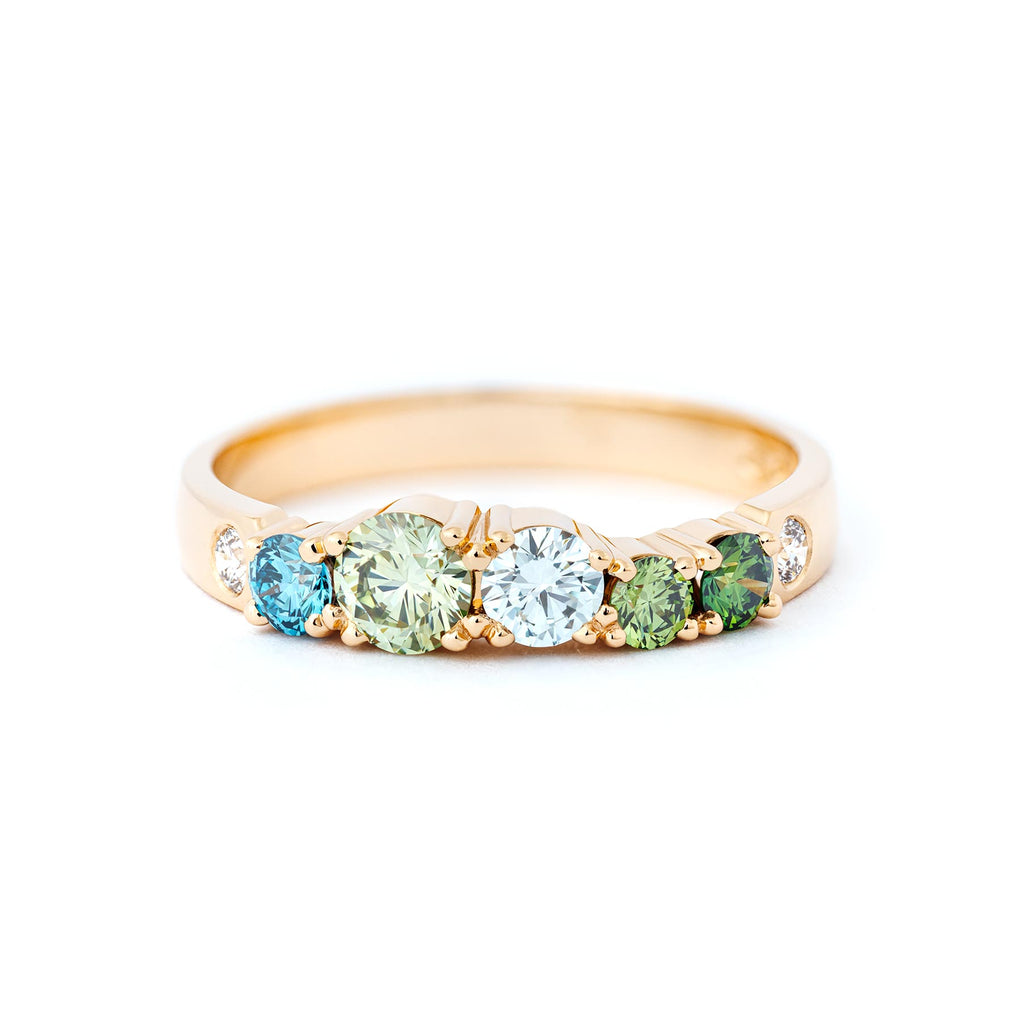 Keto Meadow ring in 18K yellow gold with different size green, turquoise and white diamonds. Design by Jussi Louesalmi, Au3 Goldsmiths.