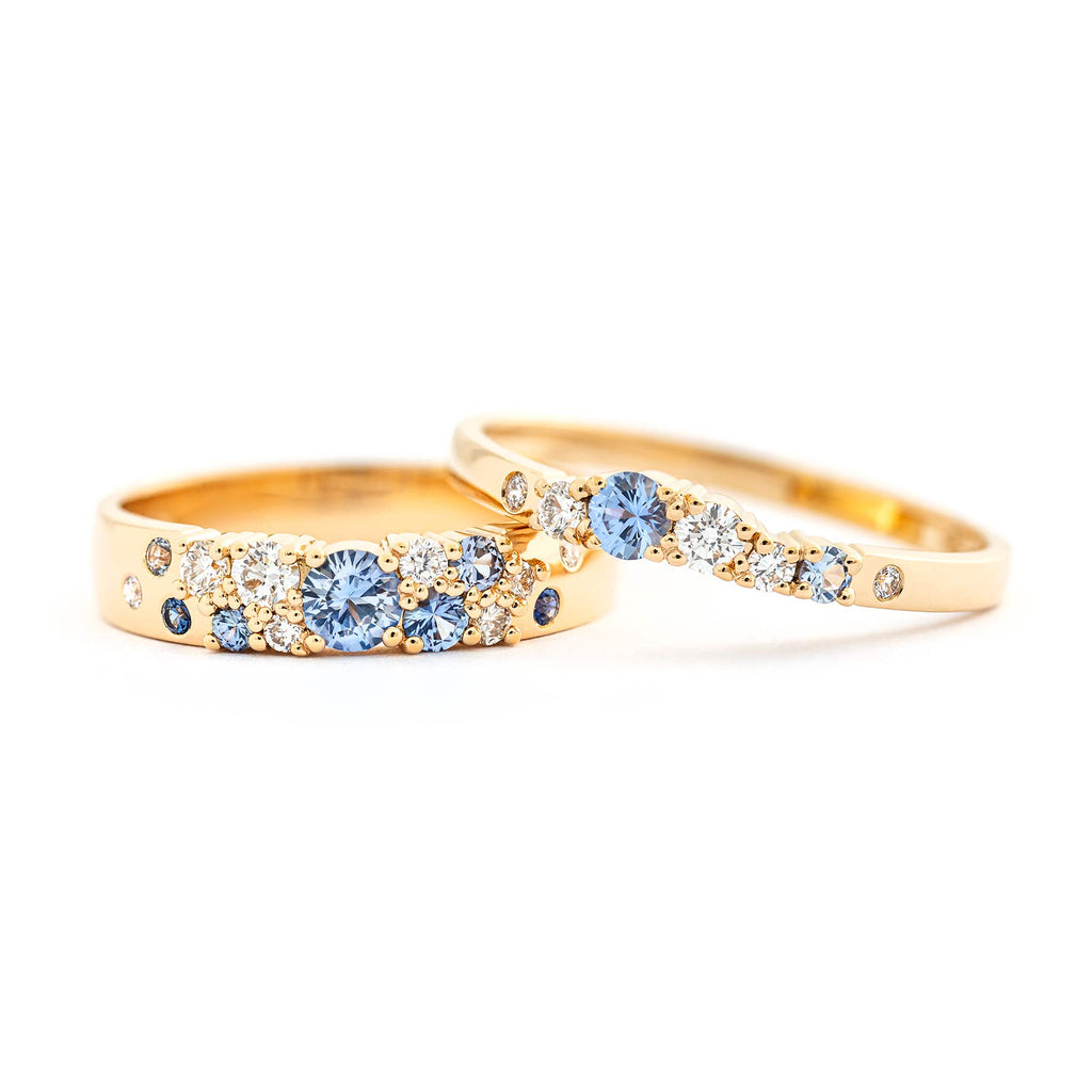 4mm and 2mm wide Keto Meadow rings made in 18K yellow gold with light blue sapphires and white tw/vs diamonds. Design by Jussi Louesalmi, Au3 Goldsmiths.