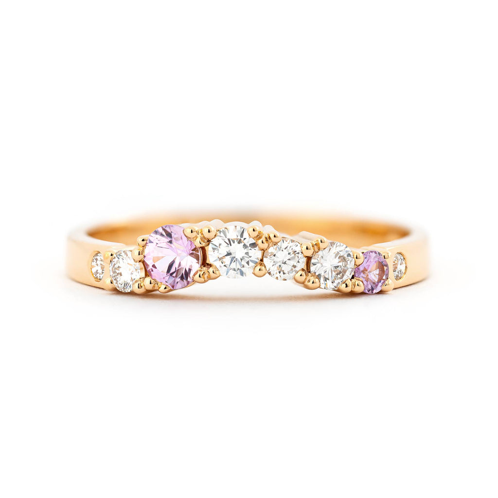 Keto Meadow Arc ring in 18K yellow gold with different size light pink sapphires and white tw/vs diamonds. Design by Jussi Louesalmi, Au3 Goldsmiths.