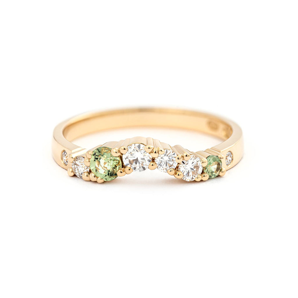 Curvy Keto Meadow Arc+ ring with pastel green sapphires and white diamonds suit well with solitaire rings. Design by Jussi Louesalmi, Au3 Goldsmiths.