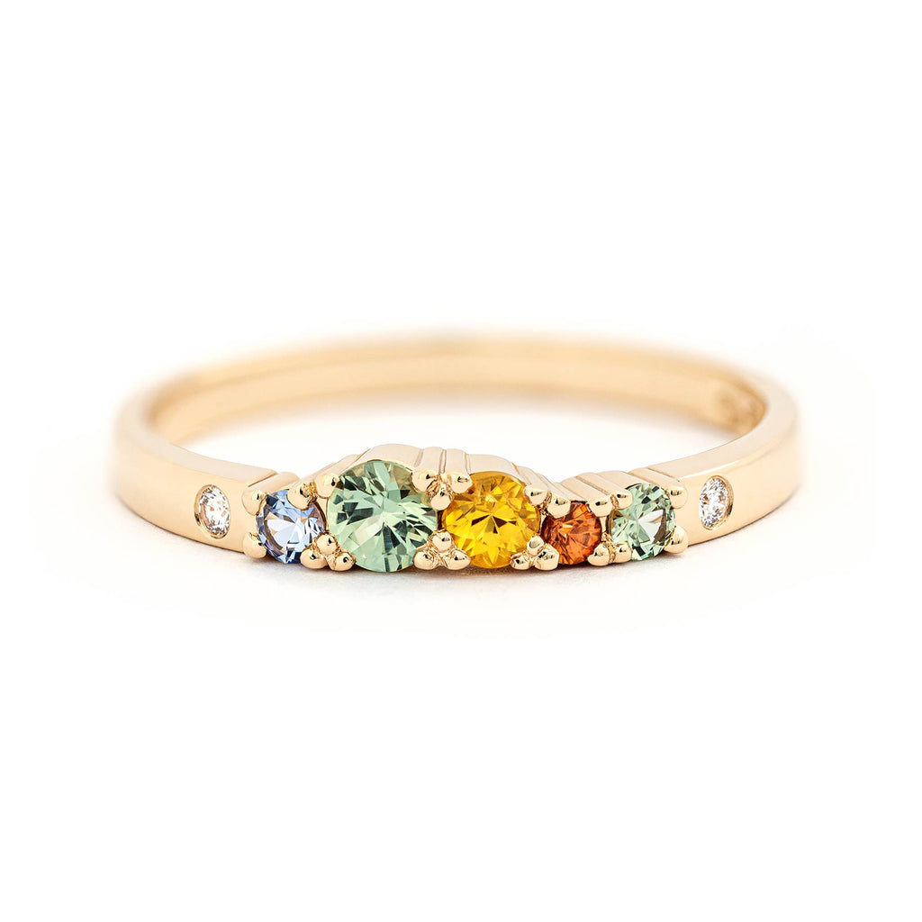2mm wide Keto Meadow ring with different size green, orange, yellow and blue sapphires and white tw/vs diamonds. Design by Jussi Louesalmi, Au3 Goldsmiths.