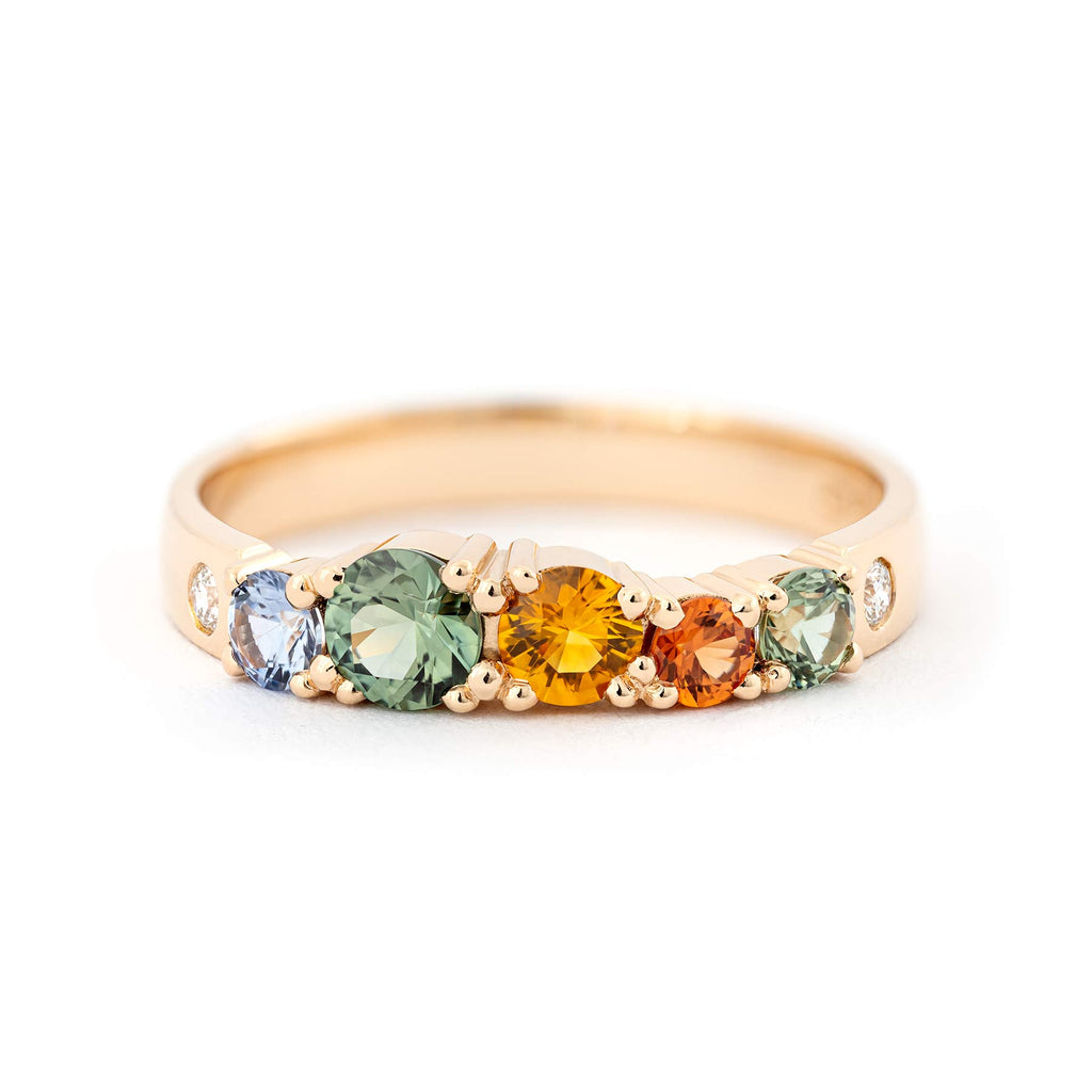 3mm wide golden Keto Meadow ring with blue, green, yellow and orange sapphires and white tw/vs diamonds. Design by Jussi Louesalmi, Au3 Goldsmiths.