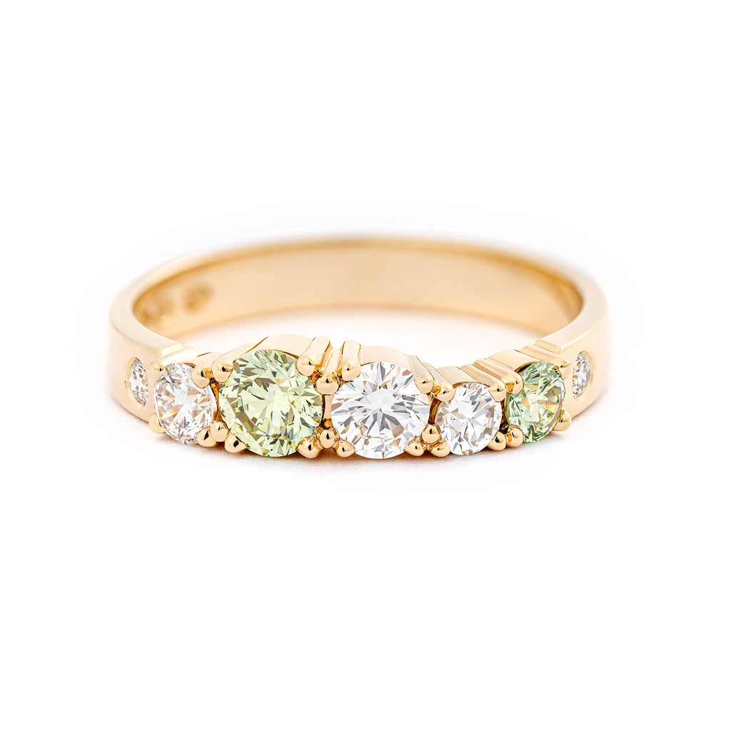 Keto Meadow Spring collection's 3mm wide ring with different size Pine Green diamonds and white diamonds. Design by Jussi Louesalmi, Au3 Goldsmiths