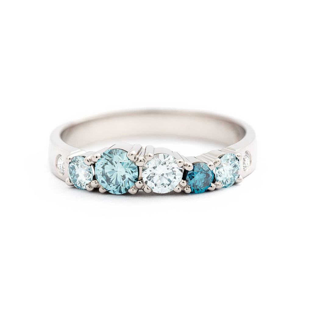 Glowing Keto Meadow ring in 750 white gold with turquoise diamonds and white tw/vs diamond. Design by Jussi Louesalmi, Au3 Goldsmiths.