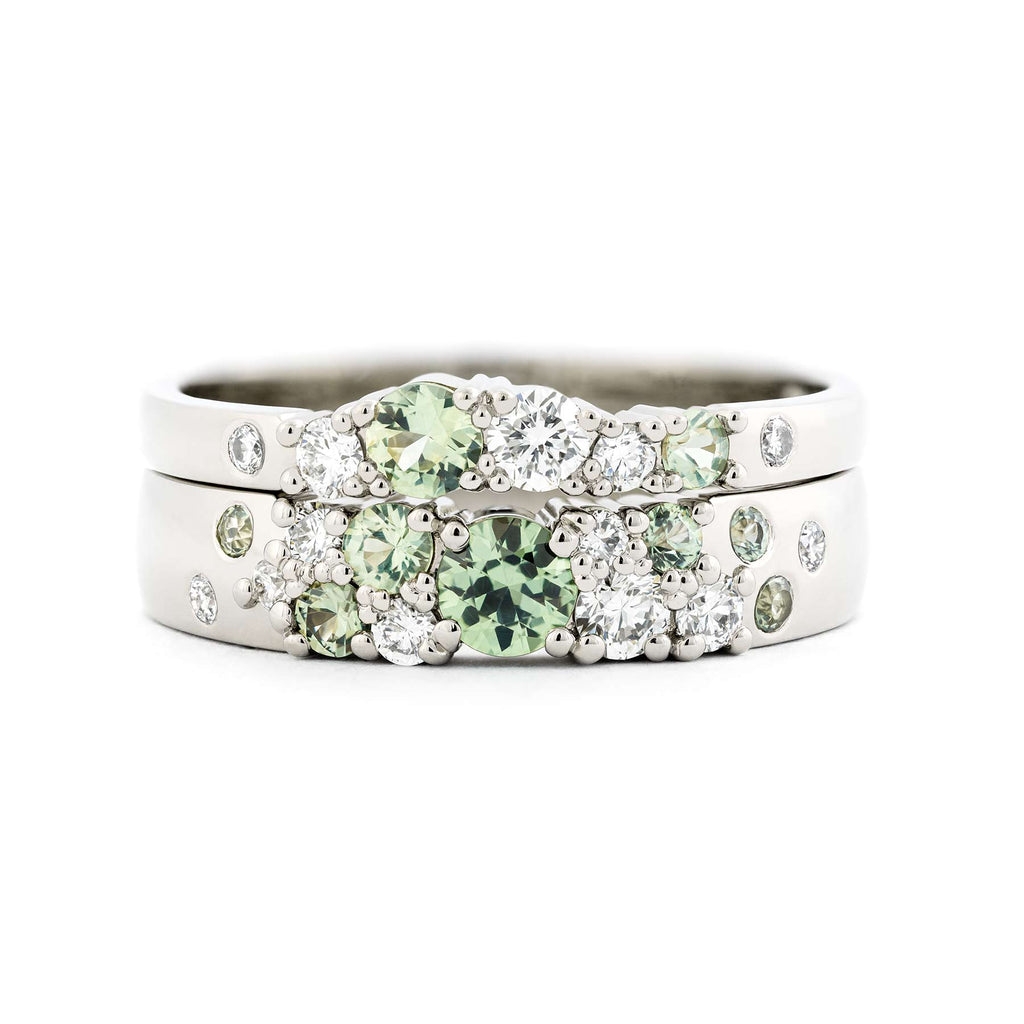 Keto Meadow 4mm and 2mm wide Spring collection's rings in 18K white gold, with light green sapphires and white tw/vs diamonds.  Design by Jussi Louesalmi, Au3 Goldsmiths.