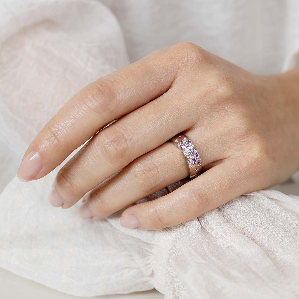 Model wearing a 6mm wide Keto Meadow Spring collections ring with pink sapphires and white diamonds. Design by Jussi Louesalmi, Au3 Goldsmiths.