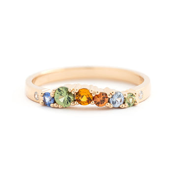 Contour model ring from the Keto Meadow jewelry collection. Made in 18K yellow gold with autumn color sapphires and white diamonds. Design by Jussi Louesalmi, Au3 Goldsmiths.