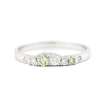Keto Meadow 2mm wide platinum ring with light green diamonds and white tw/vs diamonds. Design by Jussi Louesalmi, Au3 Goldsmiths.