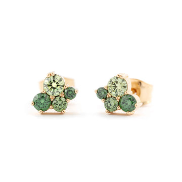 Stud earrings made in 18K yellow gold both with 4 different size treated green diamonds. Design by Jussi Louesalmi, Au3 Godldsmiths.