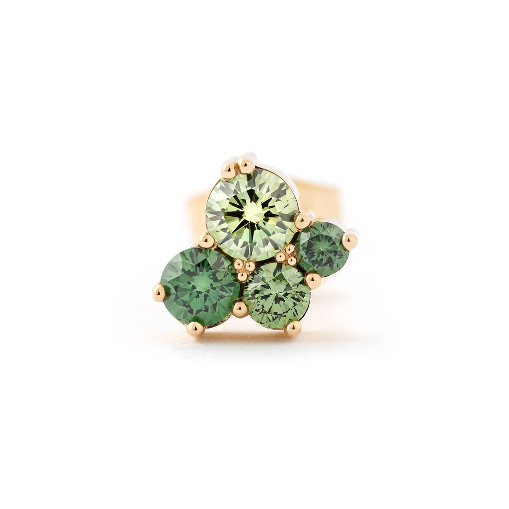 Stud earring made in 18K yellow gold with 4 different size treated green diamonds. Design by Jussi Louesalmi, Au3 Godldsmiths.
