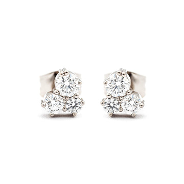 A pair of Keto Meadow stud earrings both with 3 different size white diamonds. Design by Jussi Louesalmi, Au3 Goldsmiths.