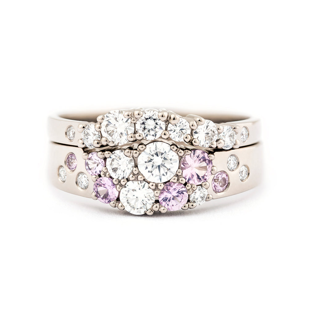 Keto Meadow narrowing ring with light pink sapphires and white diamonds combined to a Keto Meadow Arc ring with white diamonds, design by Jussi Louesalmi, Au3 Goldsmiths.