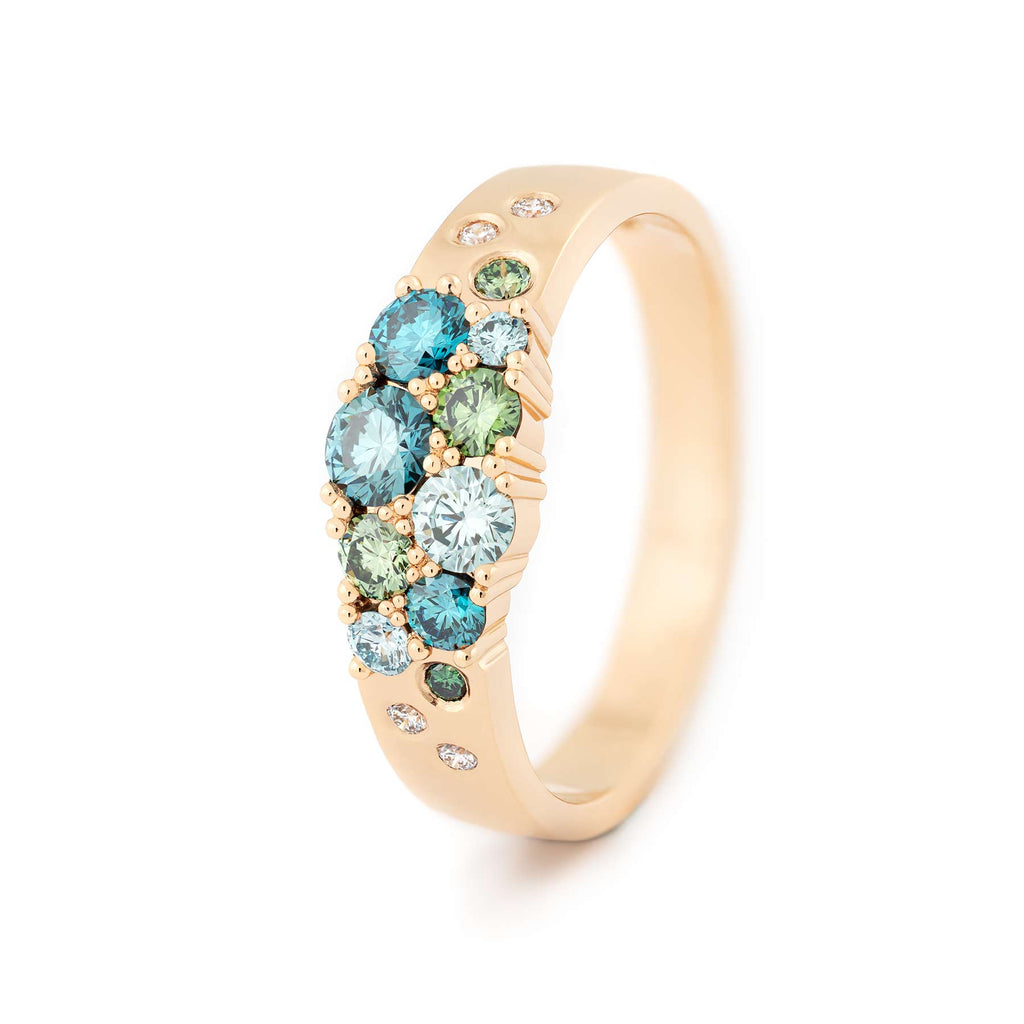 Keto Meadow narrowing model ring in 18K yellow gold with turqoise and green color diamonds and white tw/vs diamonds. Design by Jussi Louesalmi, Au3 Goldsmiths.