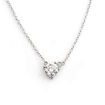 A necklace made in 18K white gold with one larger white diamond and one smaller white diamond in the side. Design Jussi Louesalmi, Au3 Goldsmiths.