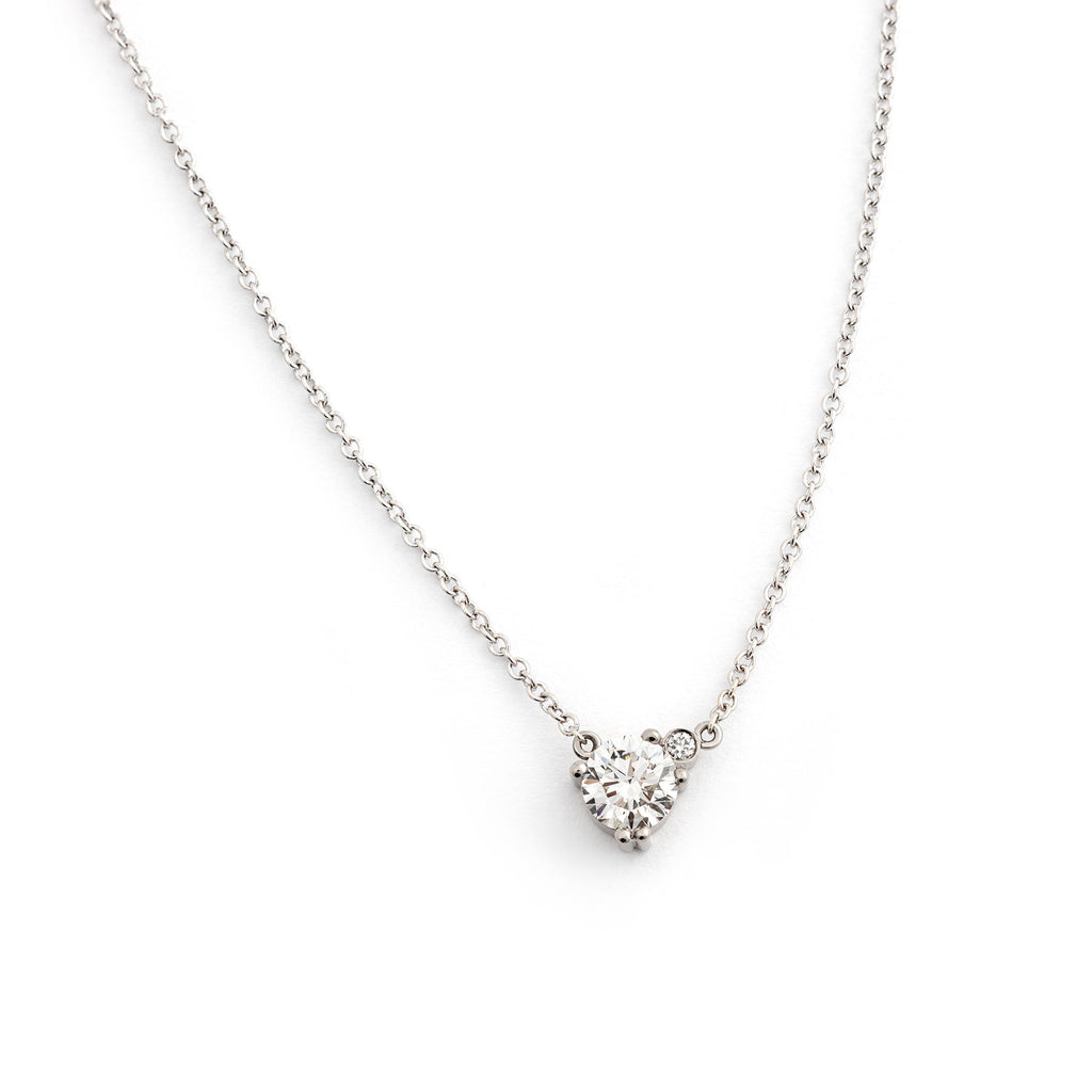 A necklace made in 18K white gold with one larger white diamond and one smaller white diamond in the side. Design Jussi Louesalmi, Au3 Goldsmiths.
