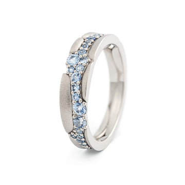Different size light blue sapphires in a ring crafted from 18K white gold. Design by Tero Hannonen, Au3 Goldsmiths.