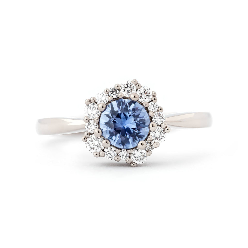 Ring with large light blue sapphire surrounded with small white diamonds. Design by Jussi Louesalmi, Au3 Goldsmiths.