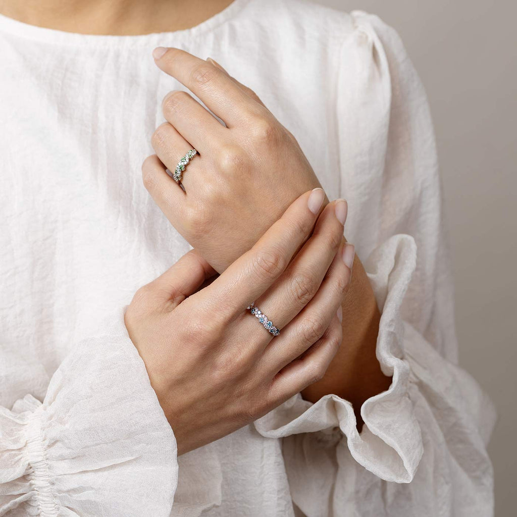 Model wearing a MyWay rings with green, blue and white diamonds. Jewelry design by goldsmith Jussi Louesalmi, Au3 Goldsmiths