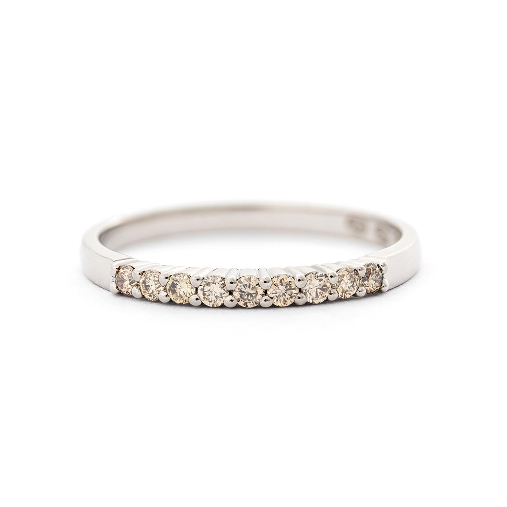 Champagne color diamonds in the 2mm wide Raita ring made in 18K white gold. Design by Jussi Louesalmi, Au3 Goldsmiths.