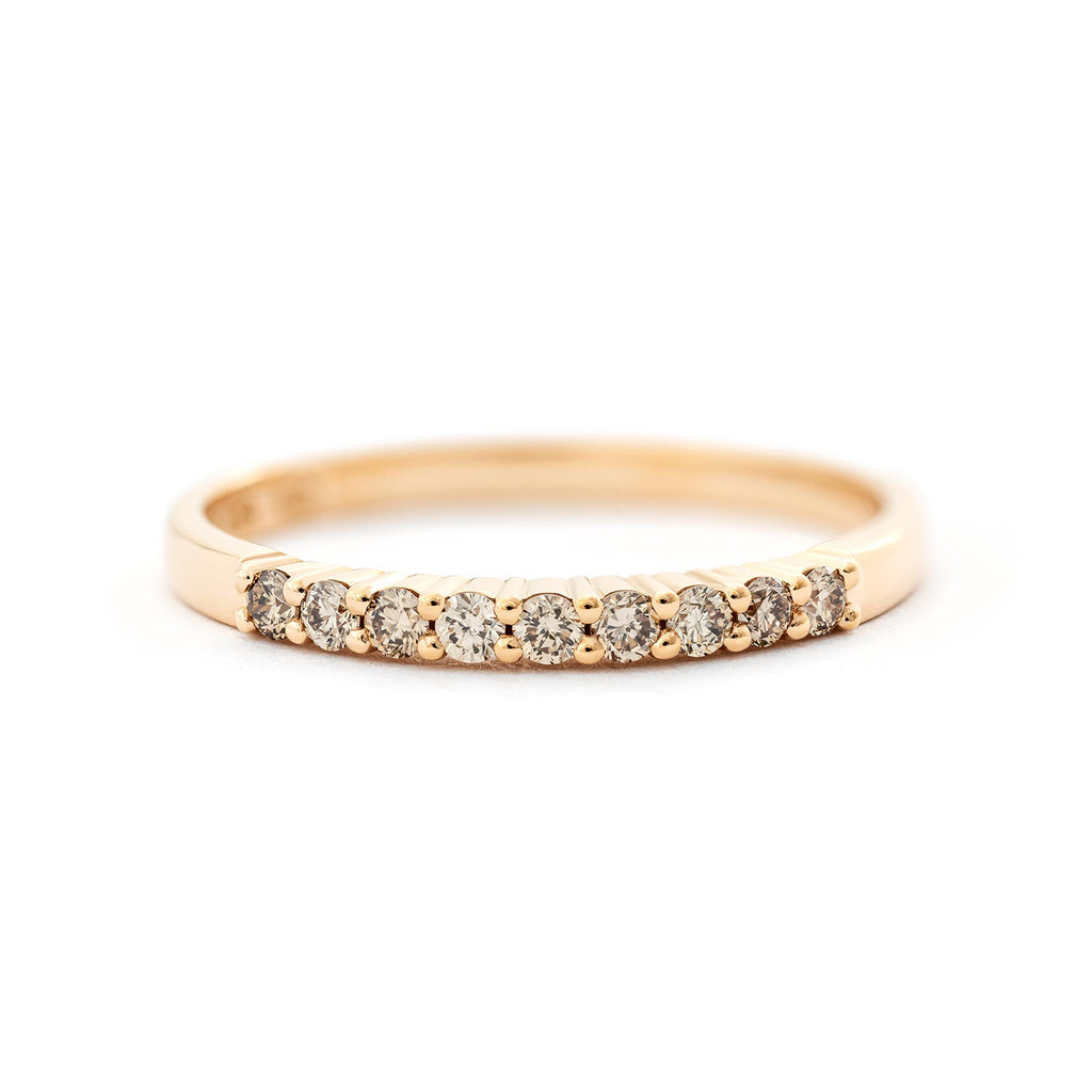 Champagne color diamonds in the 2mm wide Raita ring made in 18K yellow gold. Design by Jussi Louesalmi, Au3 Goldsmiths.
