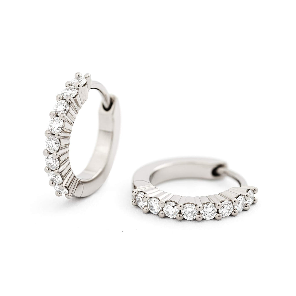Pair of hoop earrings in 18K white gold with 8 white tw/vs diamonds. Design by Jussi Louesalmi, Au3 Goldsmiths.