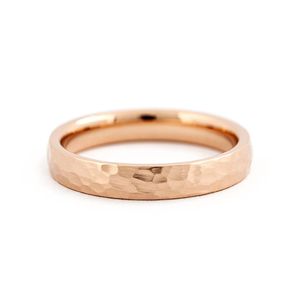 Hammered surface on a 4mm wide ring made in 18K rose gold, design by Jussi Louesalmi, Au3 Goldsmiths.