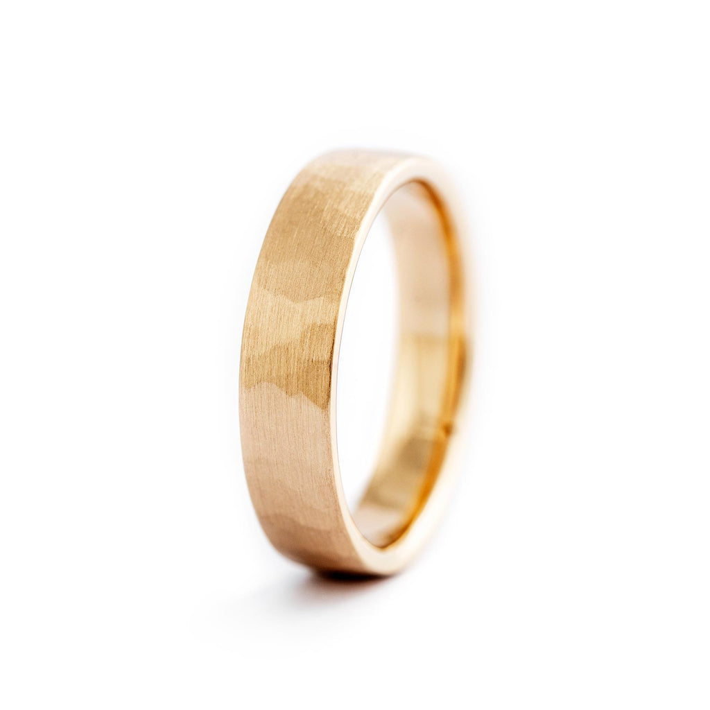 Hammered matte finish in this golden Taottu ring, design by Jussi Louesalmi, Au3 Goldsmiths