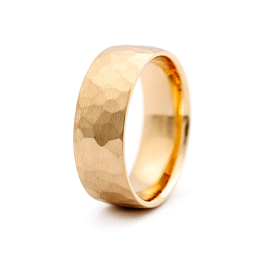 Hand-hammered surface in the 8mm wide men's ring made in 18K yellow gold by Au3 Goldsmiths