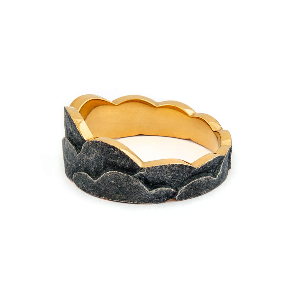 Dark patinated gold plated silver ring, with a gold lining. Design by Anu Kaartinen.