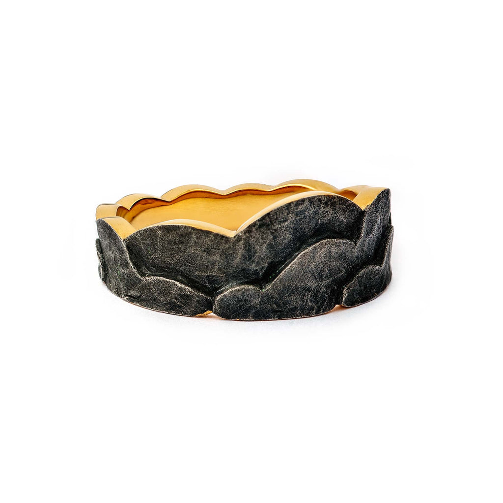 Dark patinated gold plated silver ring, with a gold lining. Design by Anu Kaartinen.