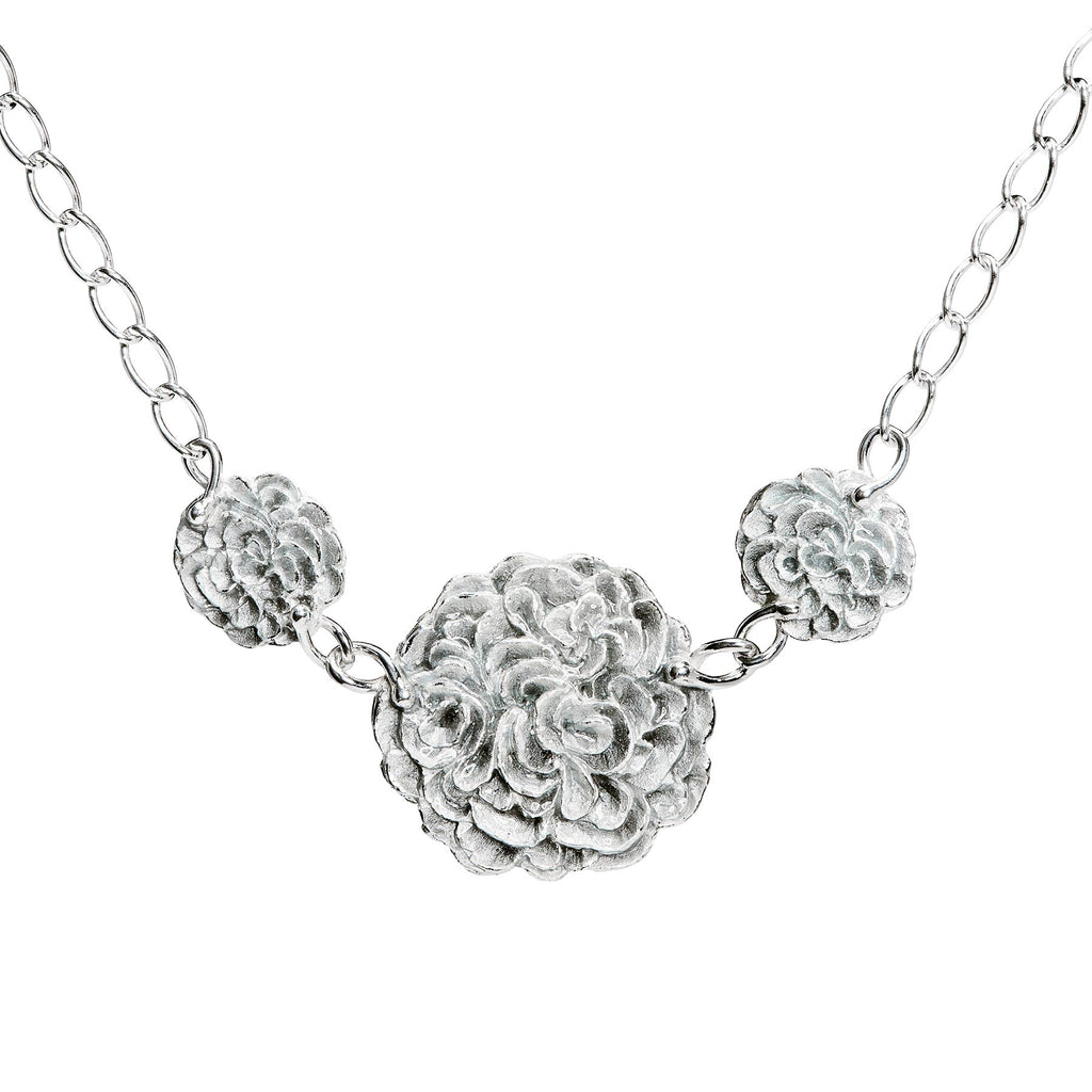 Necklace with three round parts together in a chain, light grey enamel on the surface. Design by Anu Kaartinen, Au3 Goldsmiths