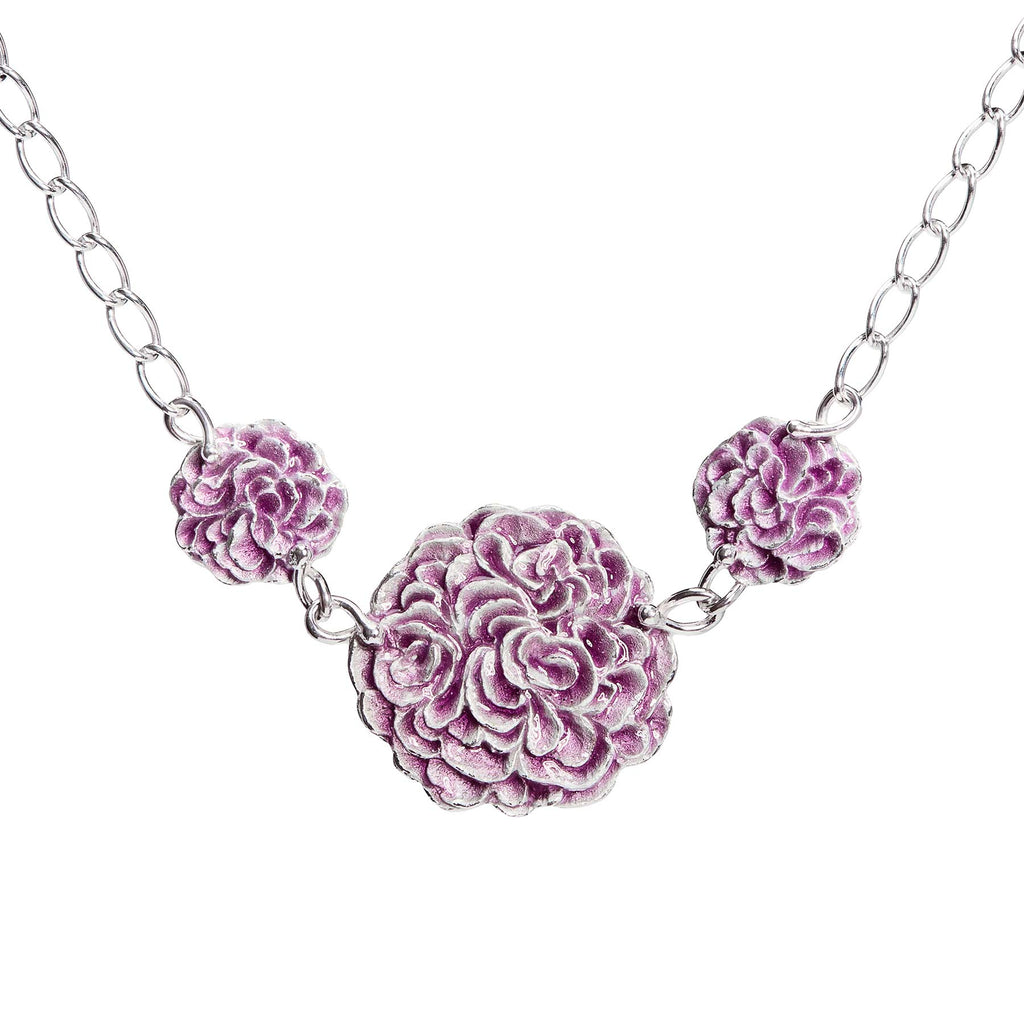 Necklace with three round parts together in a chain, purple enamel on the surface. Design by Anu Kaartinen, Au3 Goldsmiths
