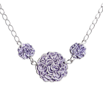Necklace with three round parts together in a chain, violet blue enamel on the surface. Design by Anu Kaartinen, Au3 Goldsmiths