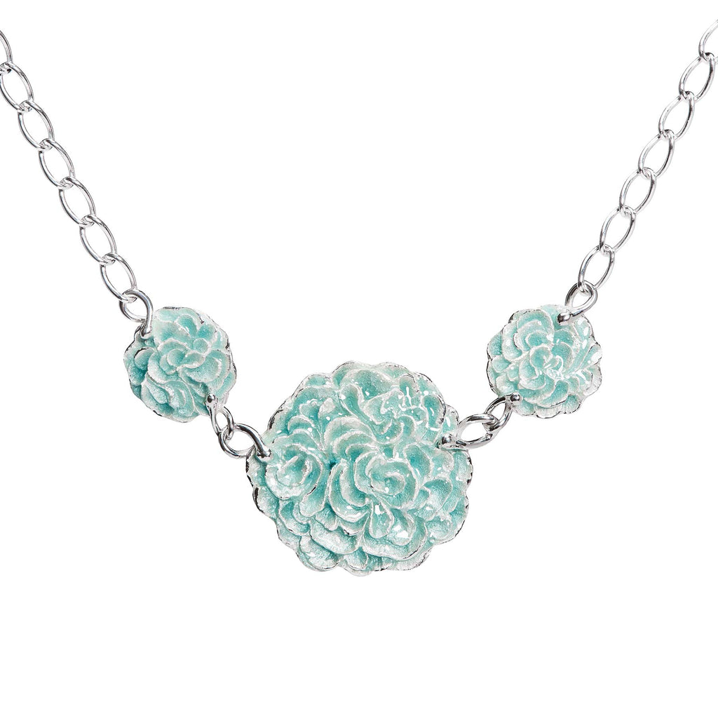 Necklace with three round parts together in a chain, turquoise enamel on the surface. Design by Anu Kaartinen, Au3 Goldsmiths