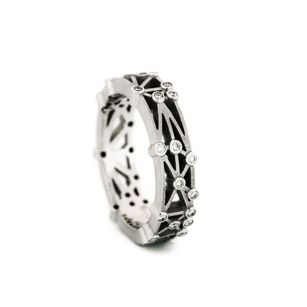Feel Code ring in 750 white gold. Small diamonds say "I Love You" in Braille writing. Design Jussi Louesalmi, Au3 Goldsmiths