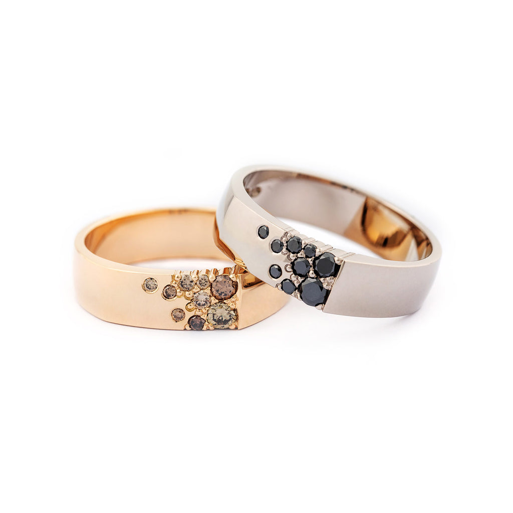 Kero rings together, materials 750 yellow gold with brown diamonds, and 750 white gold with black diamonds, design Jussi Louesalmi, Au3 Goldsmiths